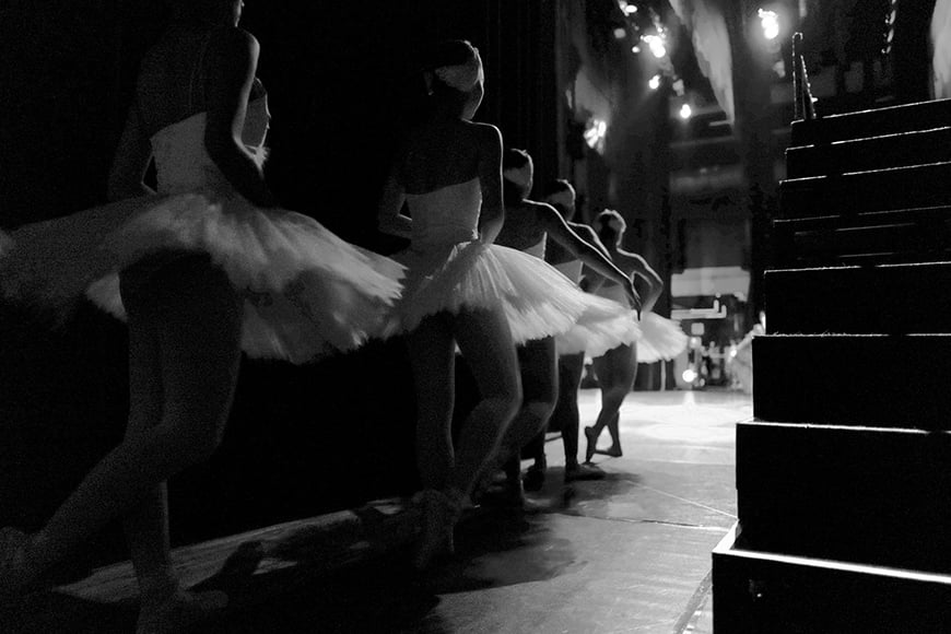 Ballerina's backstage in tutu's.